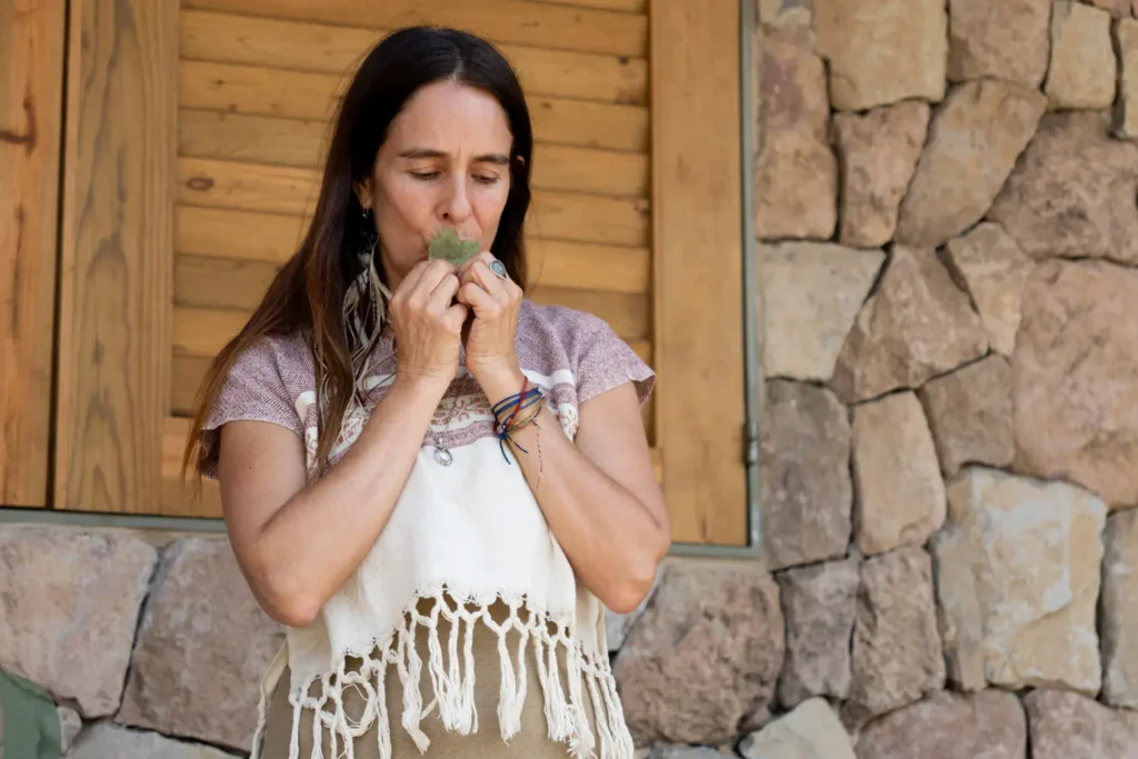 woman-smelling-sacred-leaf woman smelling sacred leaf