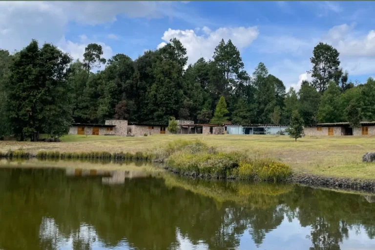 retreat buildings pond reflection