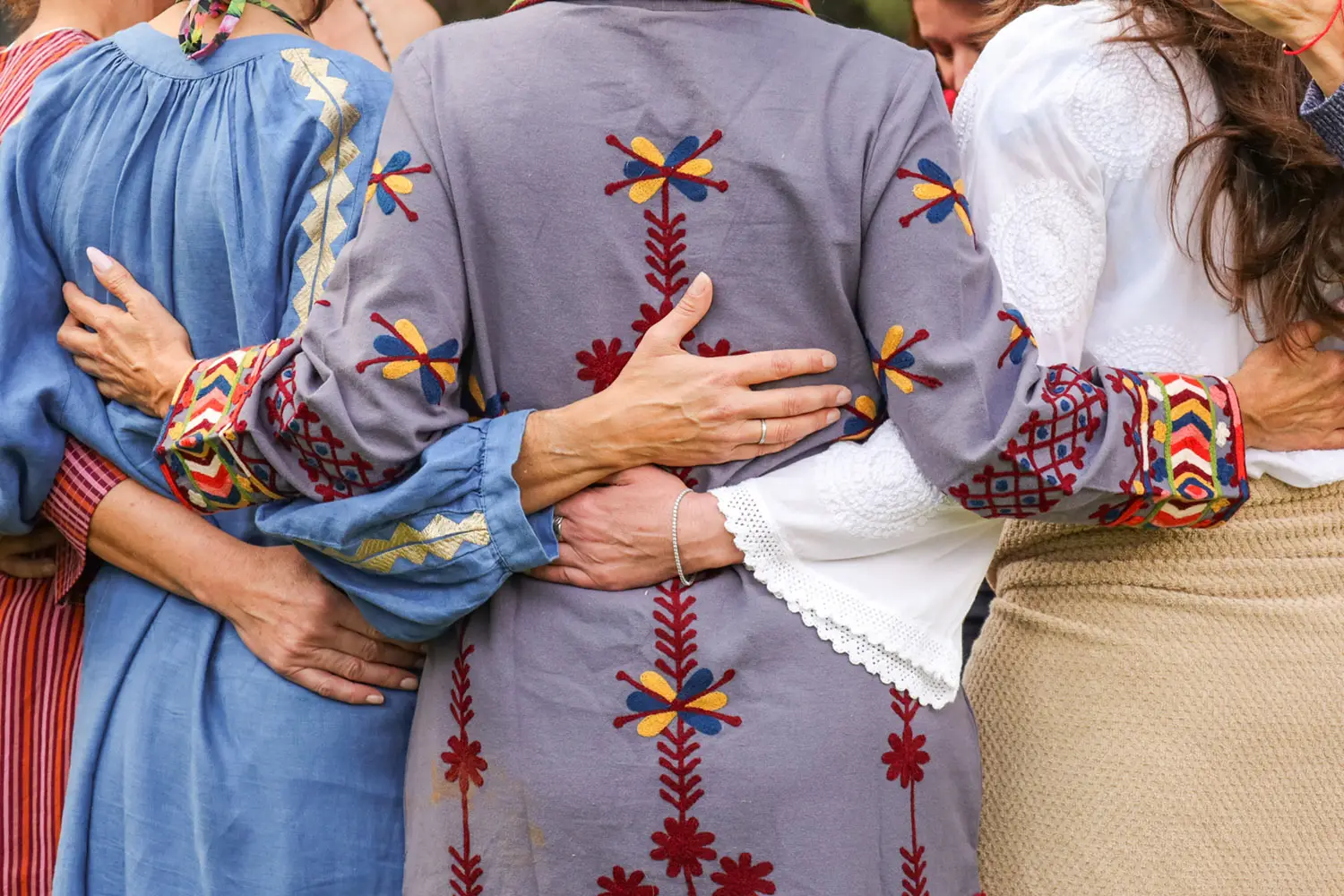 women embracing in ceremony